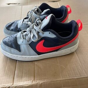 Nike Gray and Red Sneakers with Classic Silhouette